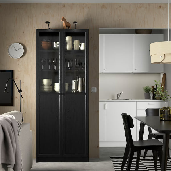 IKEA BILLY Bookcase with panel/glass doors, black oak effect, 80x30x202 cm